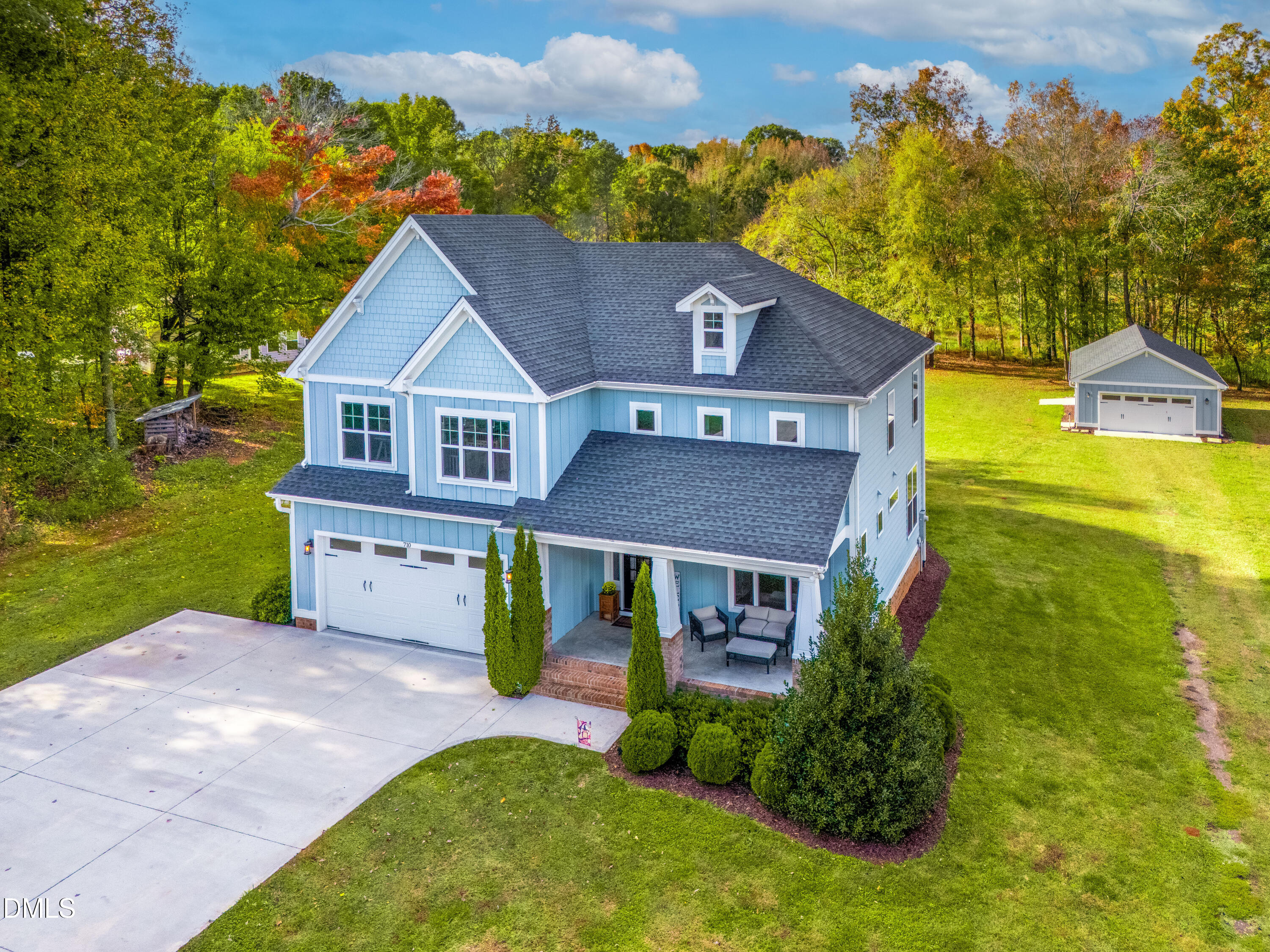 710 Hadley Mill Road Pittsboro, NC 27312 - Photo 49 of 56 a aerial view of a house with a yard table and chairs