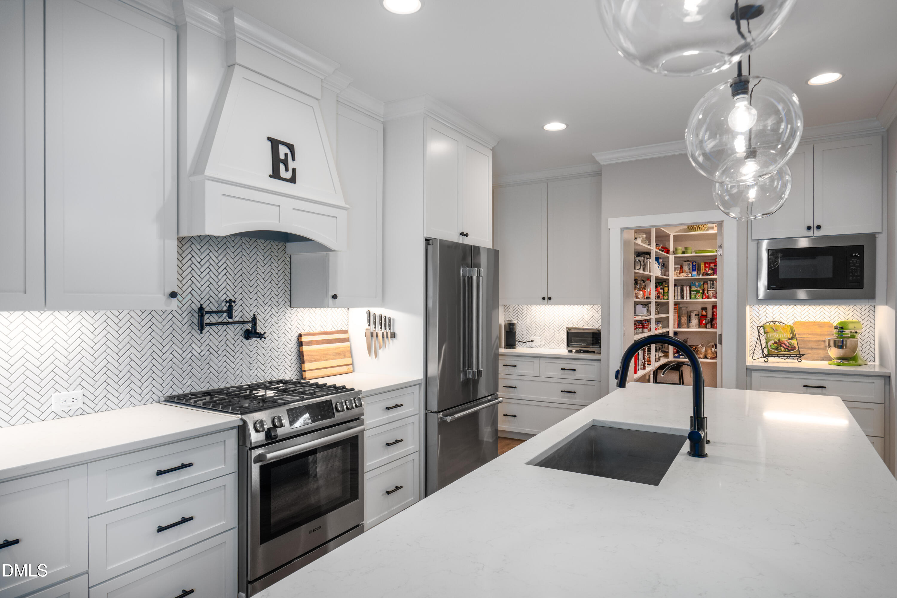 710 Hadley Mill Road Pittsboro, NC 27312 - Photo 5 of 56 a kitchen with stainless steel appliances a sink stove and refrigerator