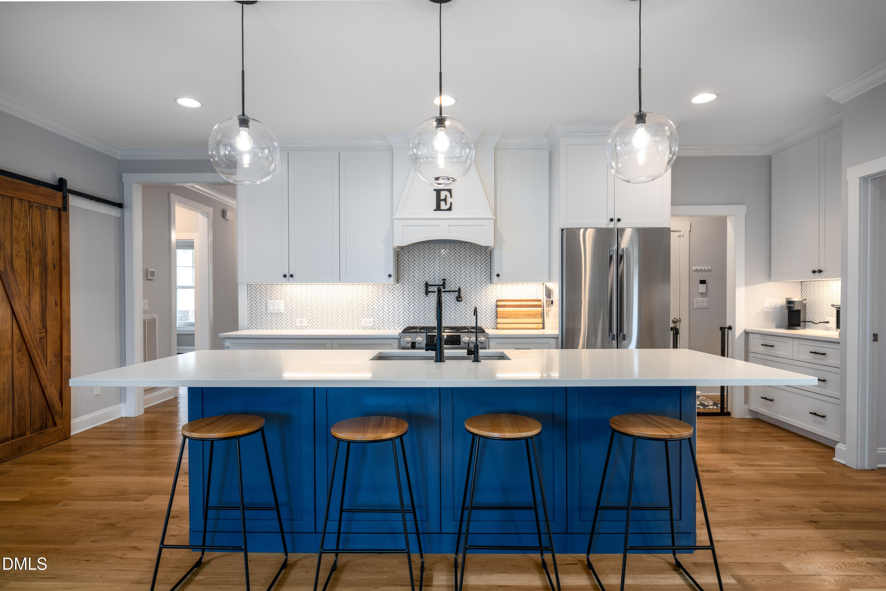 710 Hadley Mill Road Pittsboro, NC 27312 - Photo 8 of 56 a kitchen with stainless steel appliances a dining table chairs sink and refrigerator