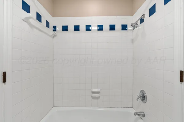 a bathroom with a sink a light fixture and a mirror