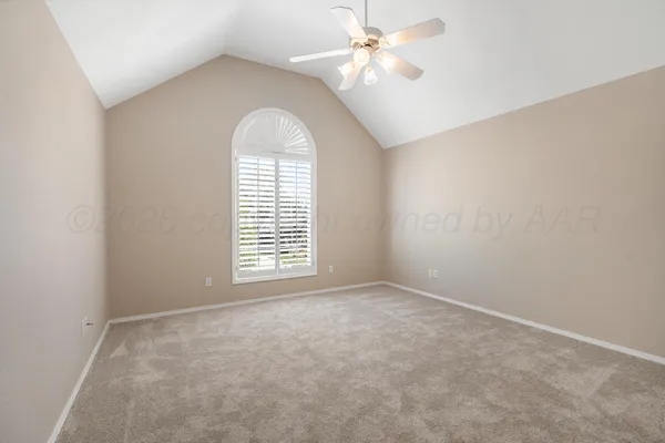 a view of an empty room with a cabinet