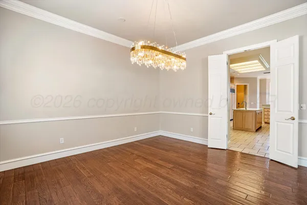 a view of staircase with white walls and a window