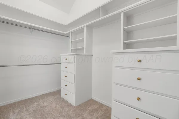 a view of an empty walk in closet