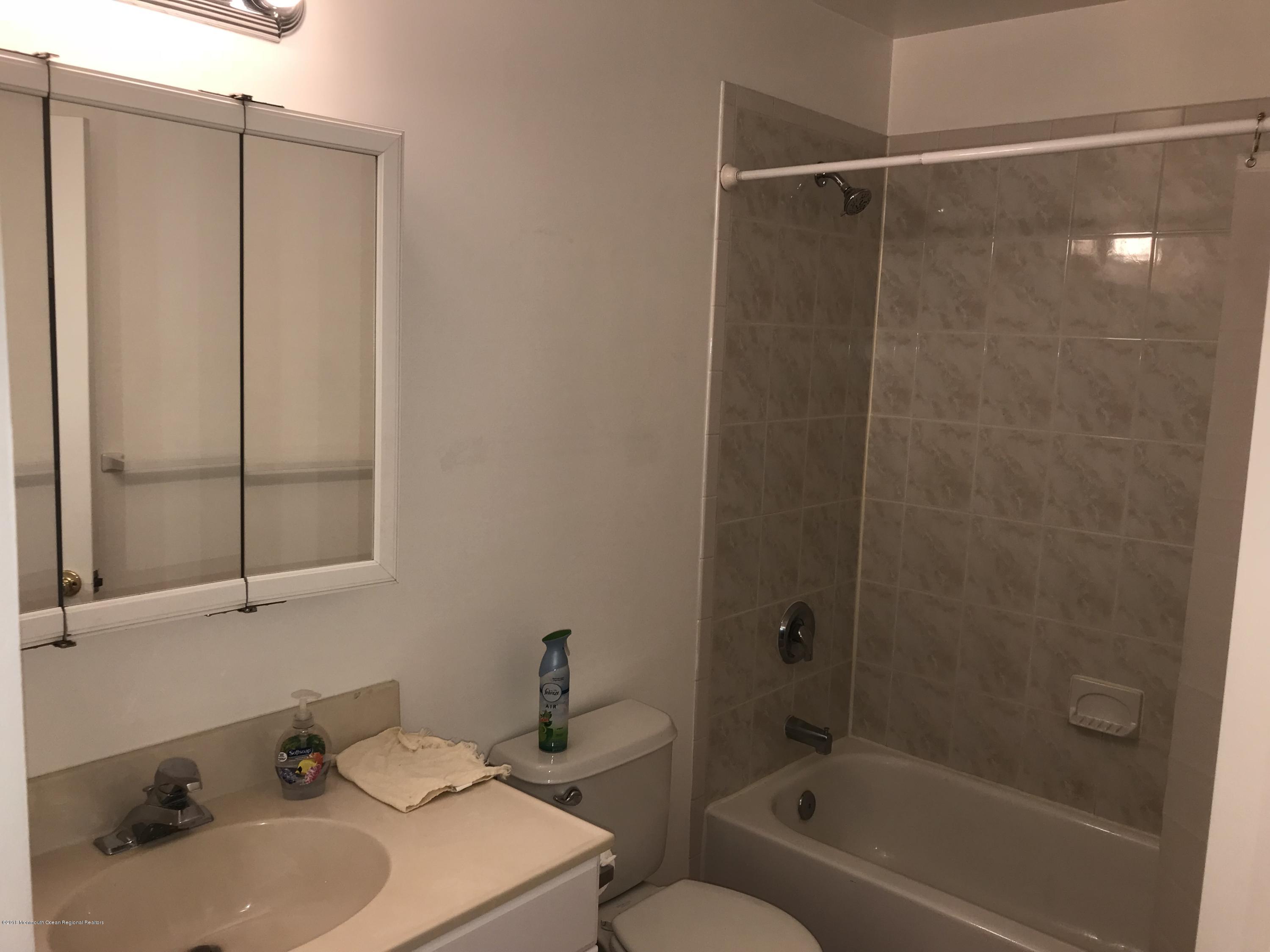 1508 Beaver Dam Road, Unit #6 Point Pleasant, NJ 08742 - Photo 3 of 7 a bathroom with a sink toilet and shower