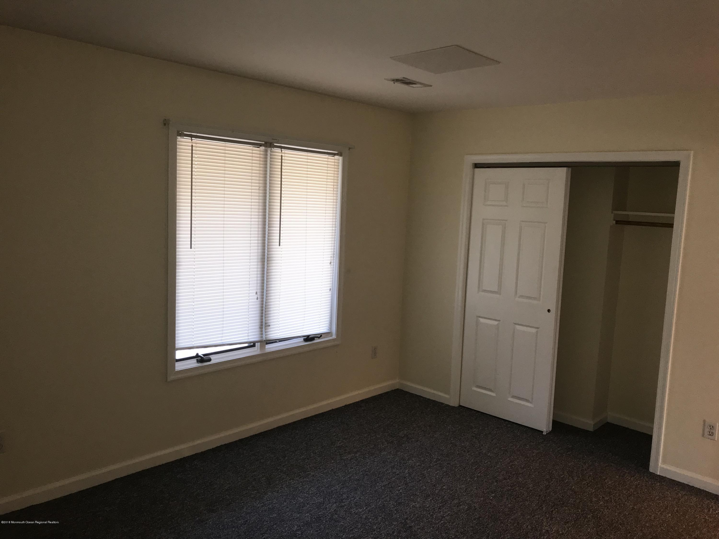 1508 Beaver Dam Road, Unit #6 Point Pleasant, NJ 08742 - Photo 4 of 7 an empty room with windows