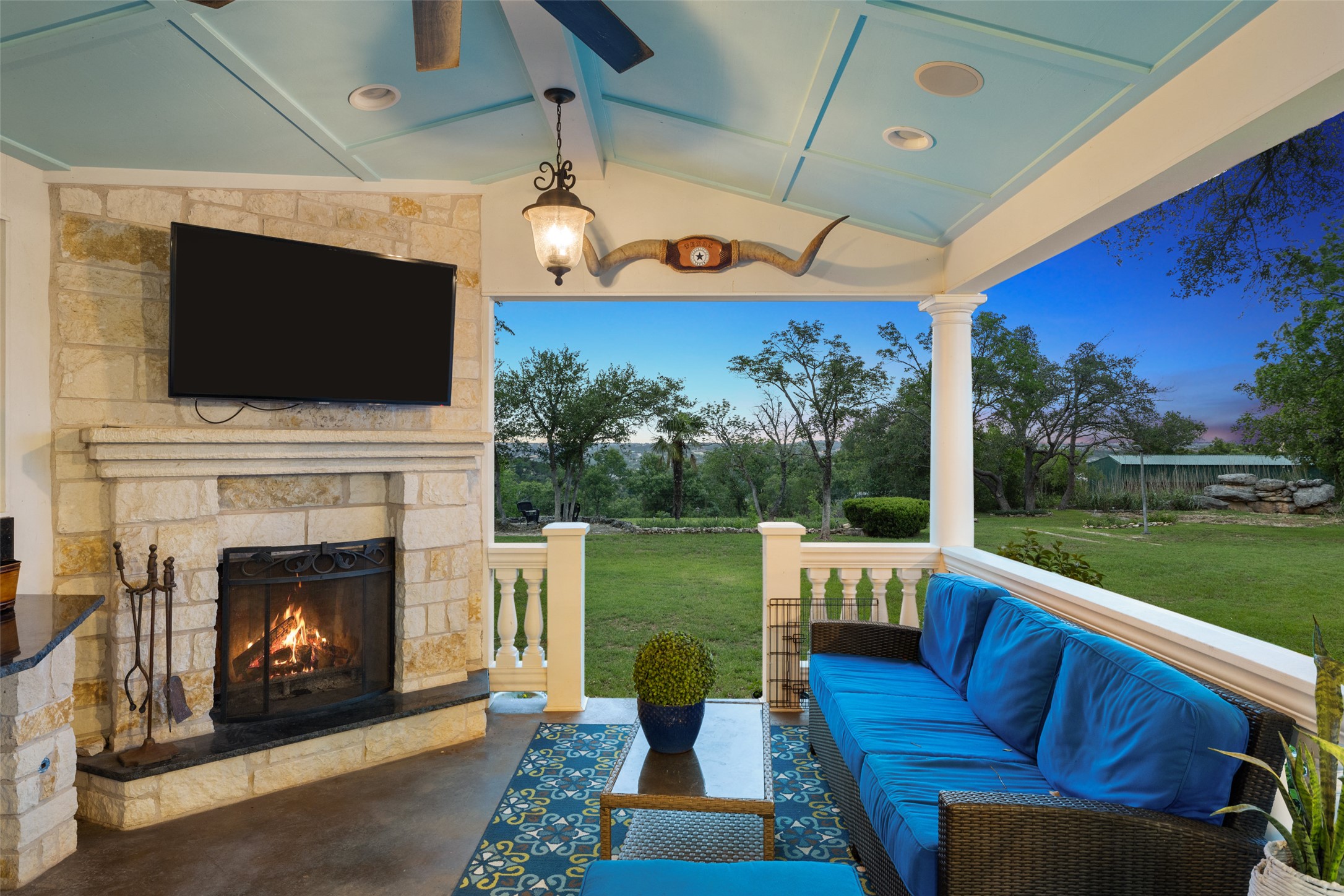17700 North Rim Drive Leander, TX 78641 - Photo 8 of 38 View of patio with an outdoor living space with a fireplace
