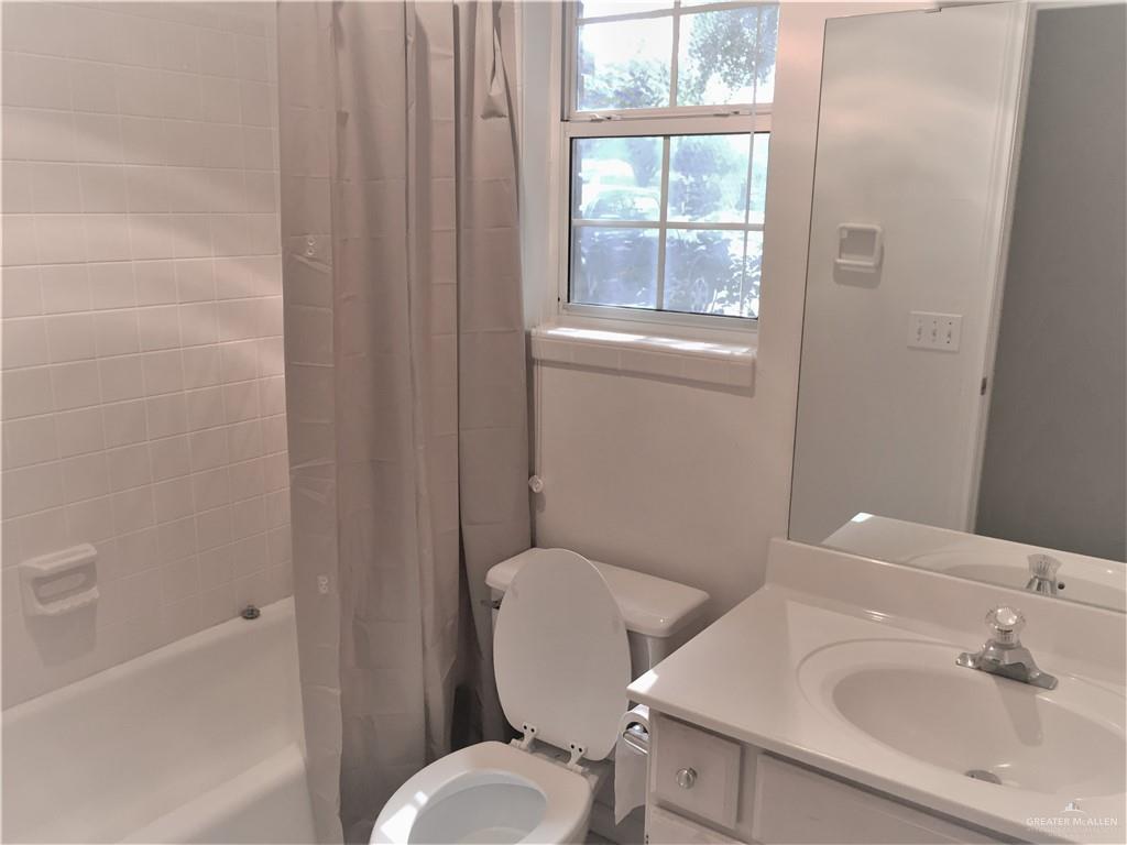 2917 North 43rd Street McAllen, TX 78501 - Photo 14 of 24 a bathroom with a toilet and a sink