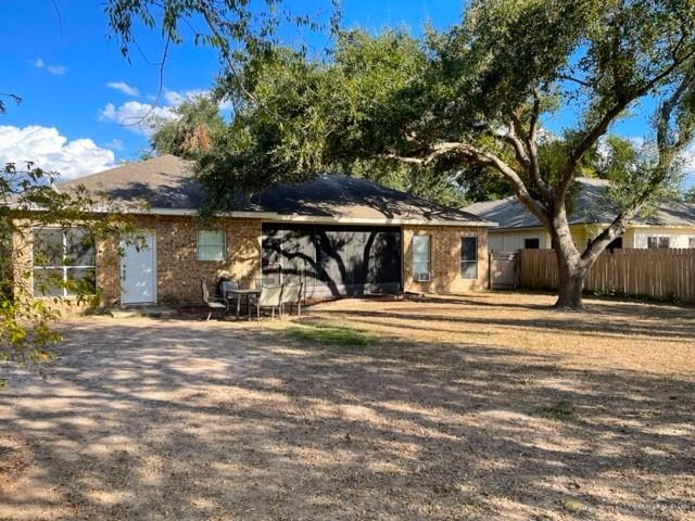 2917 North 43rd Street McAllen, TX 78501 - Photo 24 of 24 a view of a house with large trees and a wooden fence
