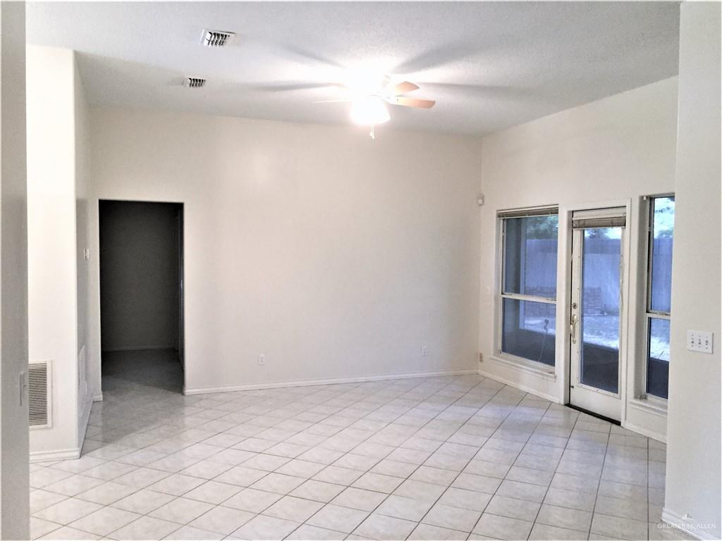 2917 North 43rd Street McAllen, TX 78501 - Photo 3 of 24 a view of an empty room with window and chandelier fan