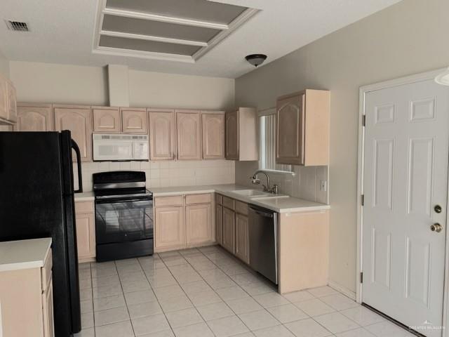 2917 North 43rd Street McAllen, TX 78501 - Photo 8 of 24 a kitchen with a stove sink and refrigerator