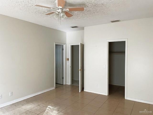 2917 North 43rd Street McAllen, TX 78501 - Photo 10 of 24 a view of an empty room with a ceiling fan