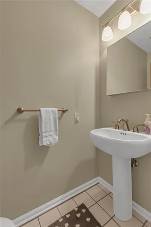a bathroom with a sink and mirror