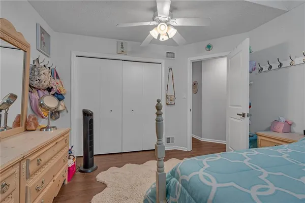 a bedroom with a bed and a walk in closet