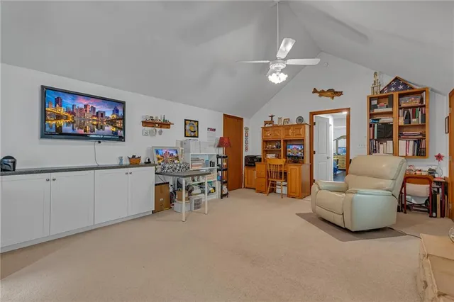 a view of a livingroom with furniture and a flat screen tv