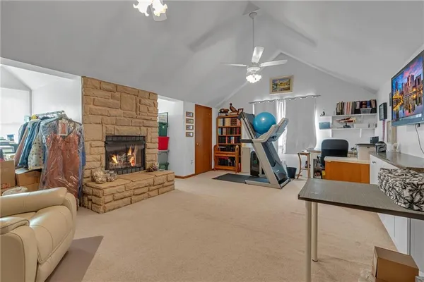 a view of a livingroom with furniture and a flat screen tv