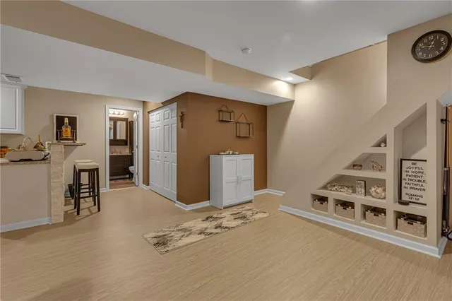 a view of a livingroom with furniture and staircase