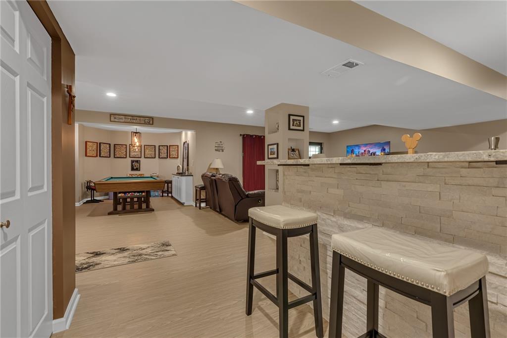 936 Mcelhaney Road Freedom, PA 15042 - Photo 30 of 48 Wet bar featuring leather granite