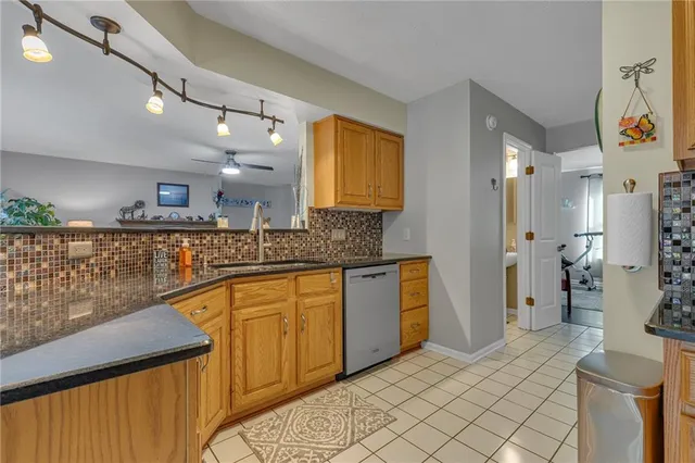 a bathroom with a sink a mirror and a shower
