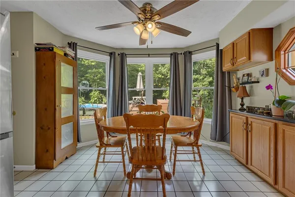 a dining room with furniture and window