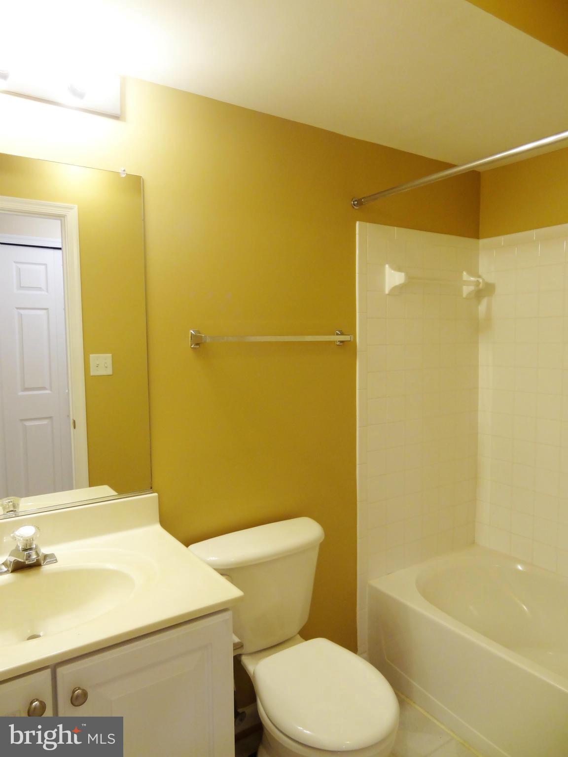 2032 University Boulevard West, Unit 3 Silver Spring, MD 20902 - Photo 11 of 16 a bathroom with a sink a toilet and shower