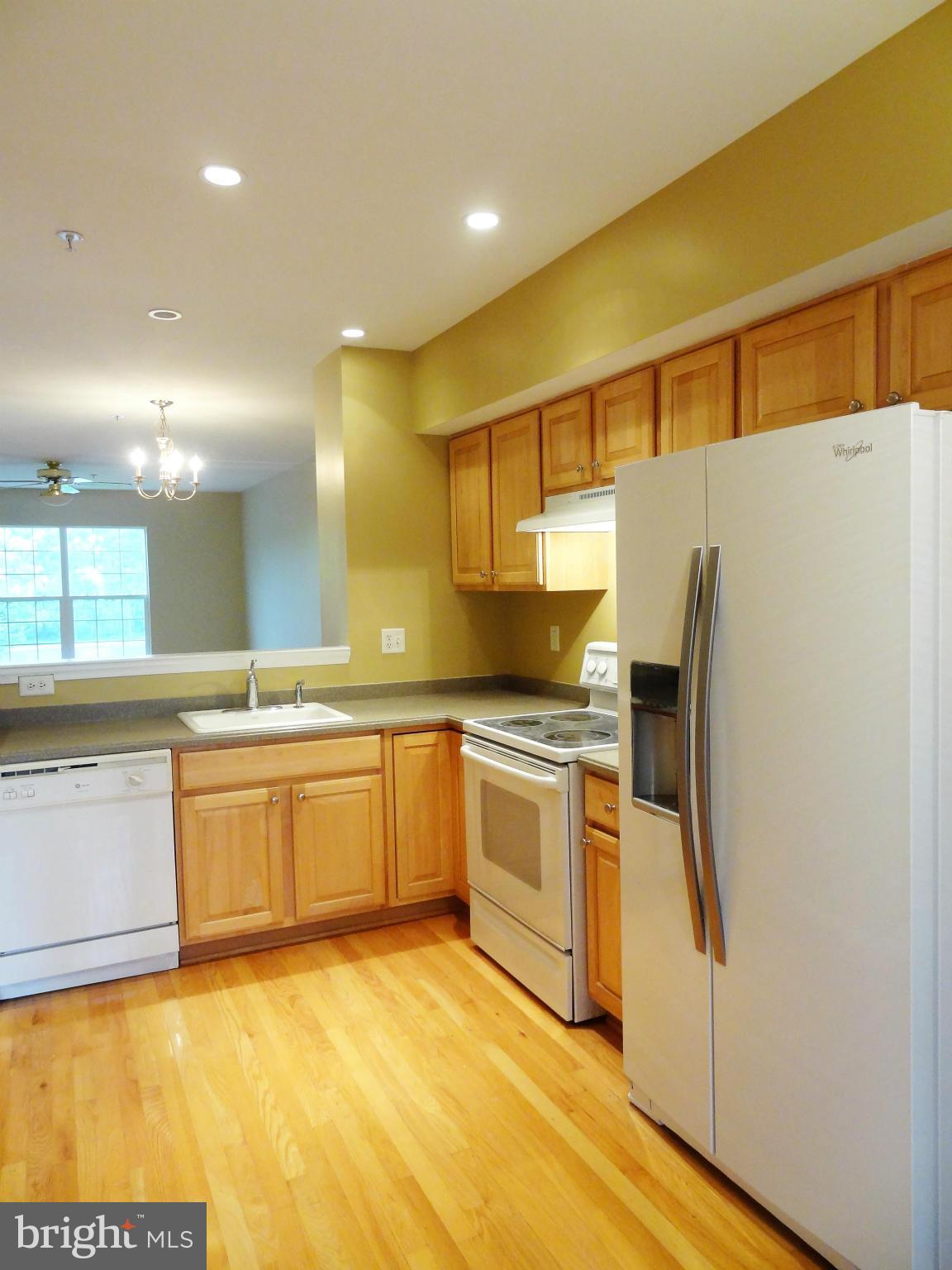 2032 University Boulevard West, Unit 3 Silver Spring, MD 20902 - Photo 5 of 16 a large kitchen with stainless steel appliances granite countertop a sink and cabinets
