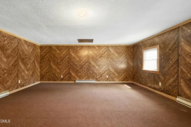 an empty room with a empty space and a window