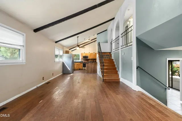 a view of an entryway with wooden floor