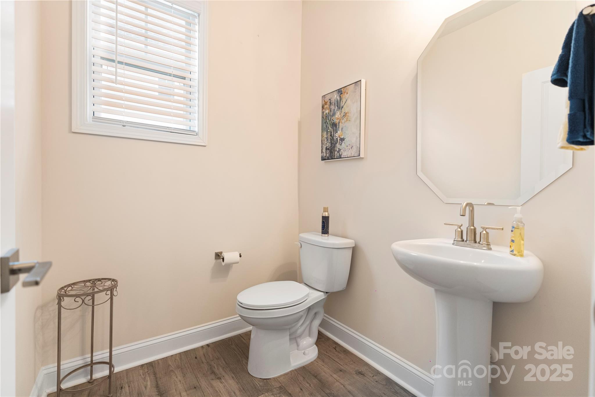 141 Rhuidean Court Troutman, NC 28166 - Photo 15 of 29 a bathroom with a toilet sink and mirror