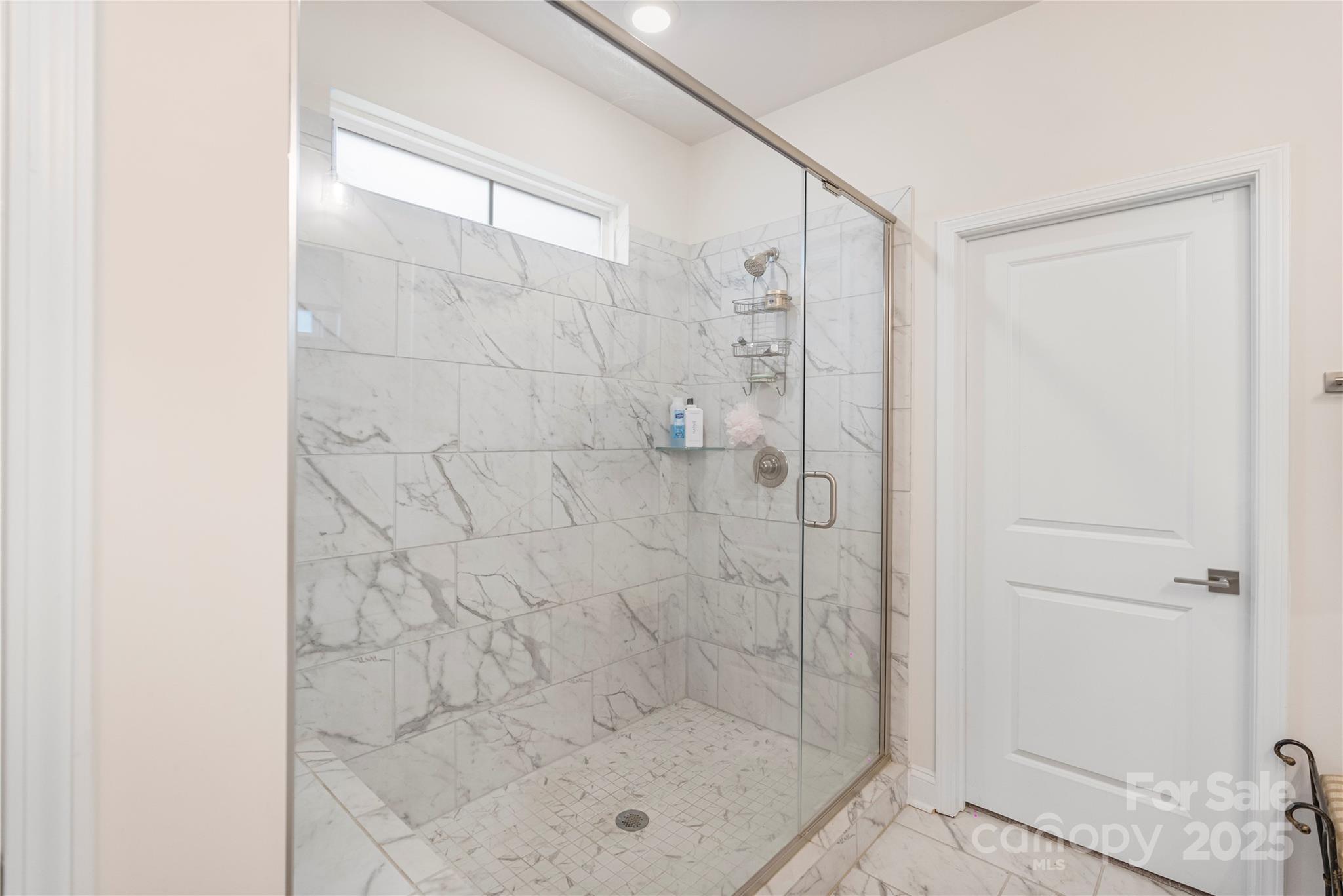 141 Rhuidean Court Troutman, NC 28166 - Photo 20 of 29 a bathroom with a shower