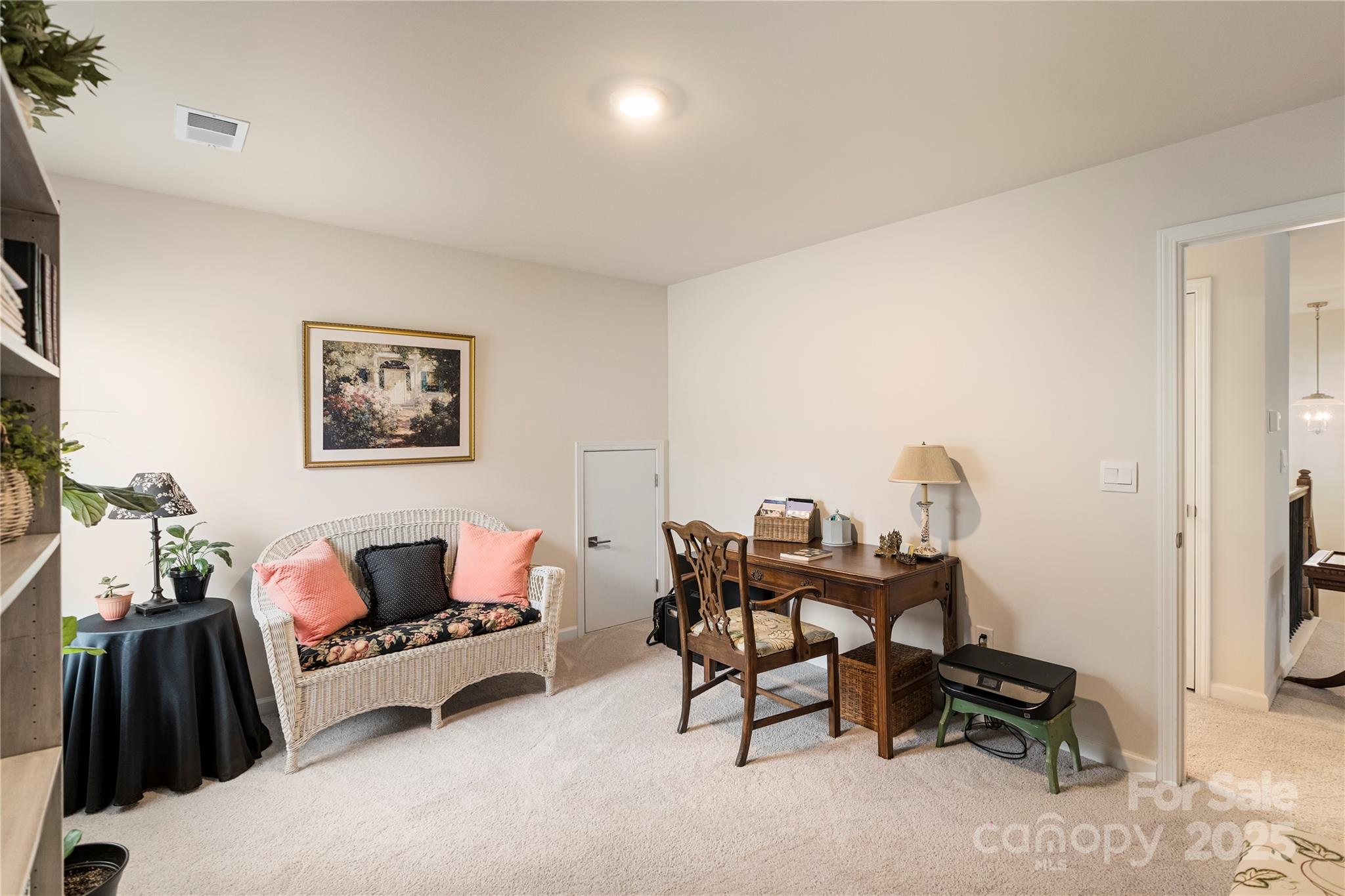 141 Rhuidean Court Troutman, NC 28166 - Photo 24 of 29 a living room with furniture and a flat screen tv