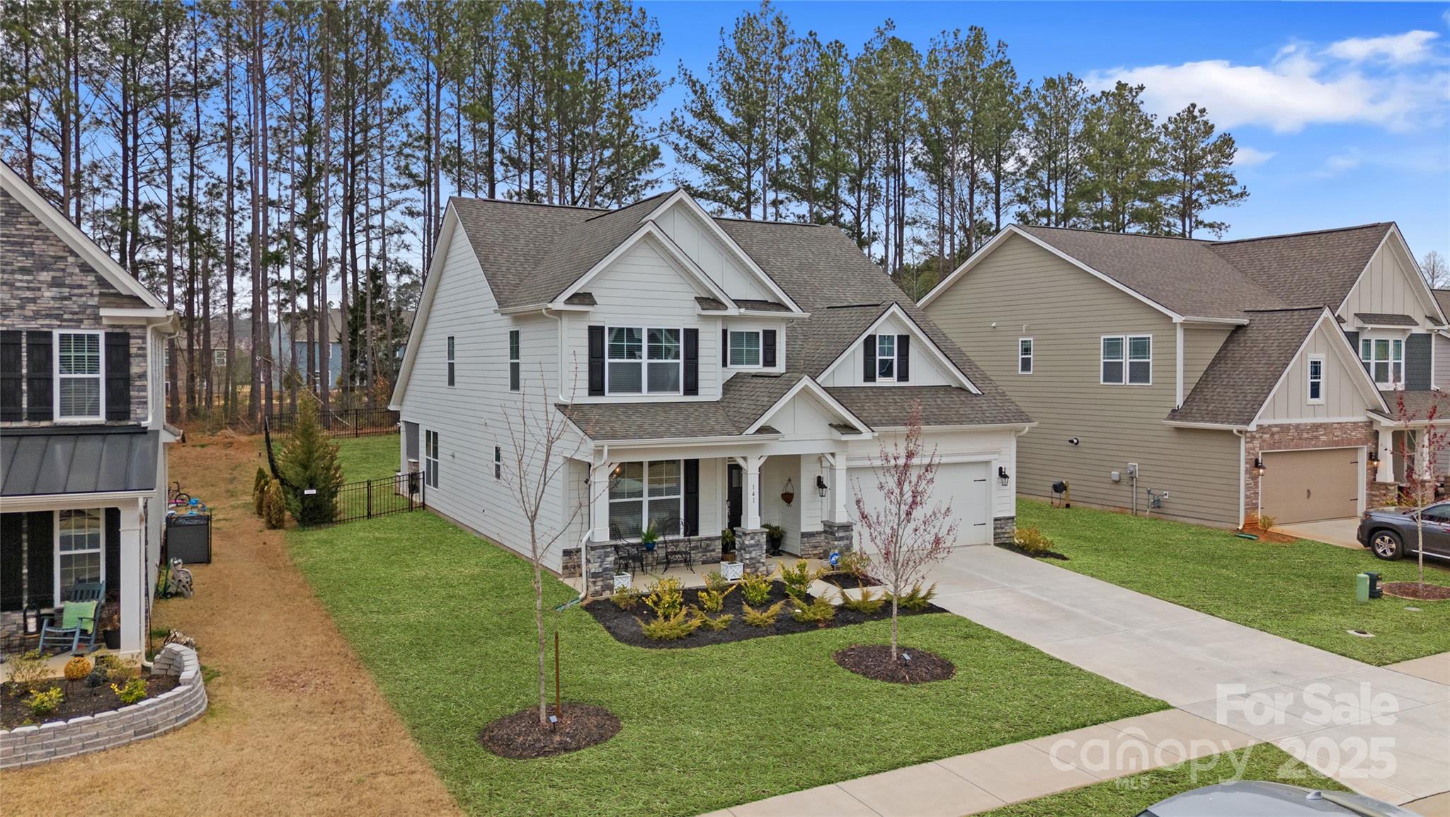 141 Rhuidean Court Troutman, NC 28166 - Photo 3 of 29 a front view of a house with yard and green space