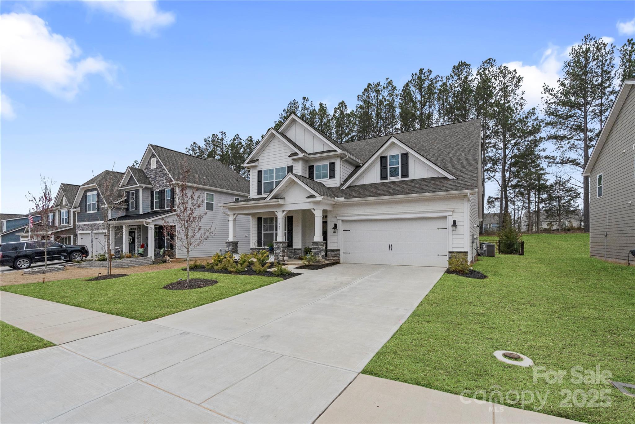 141 Rhuidean Court Troutman, NC 28166 - Photo 4 of 29 a front view of a house with a yard