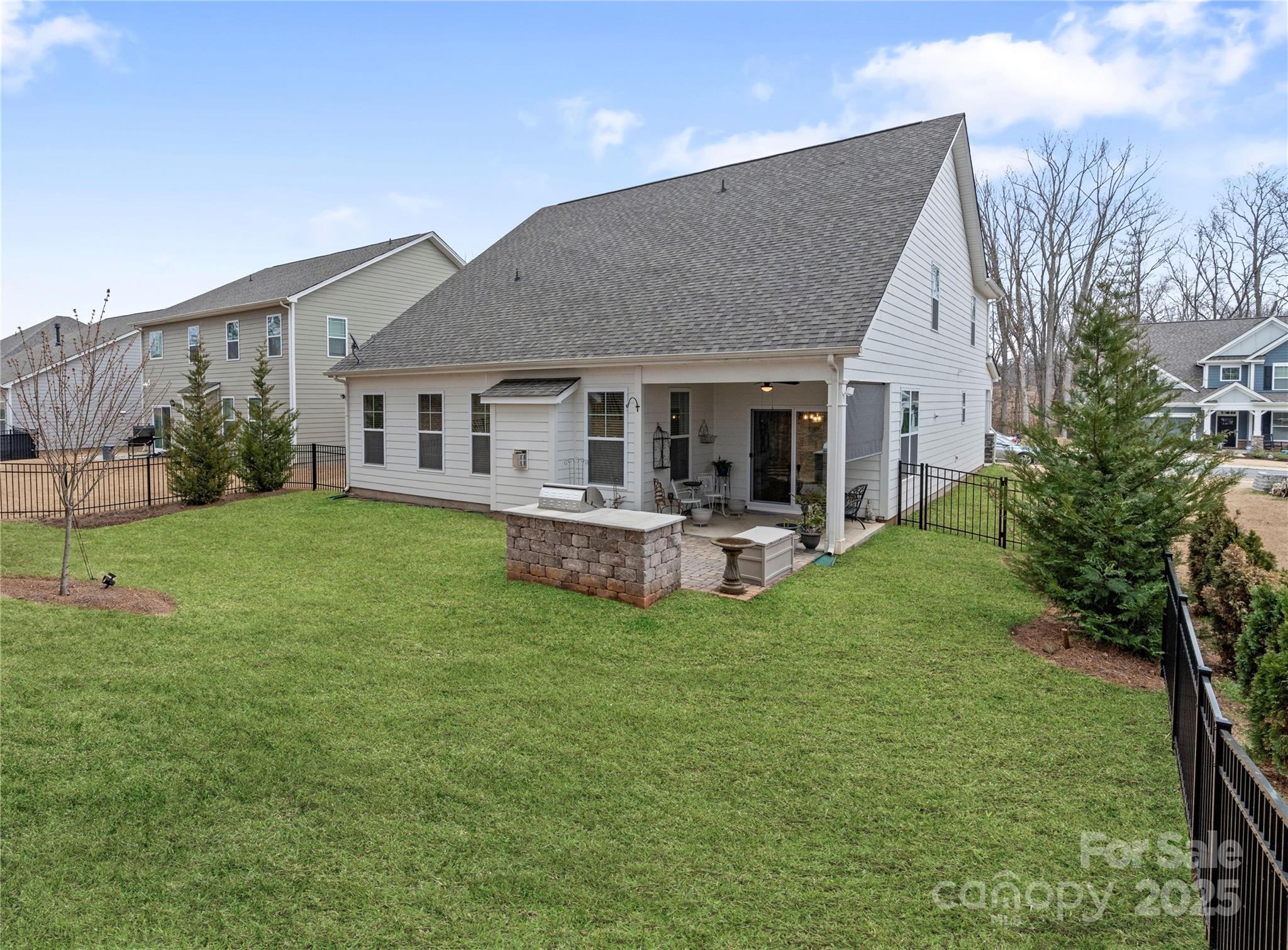 141 Rhuidean Court Troutman, NC 28166 - Photo 6 of 29 a view of a house with a backyard and a patio