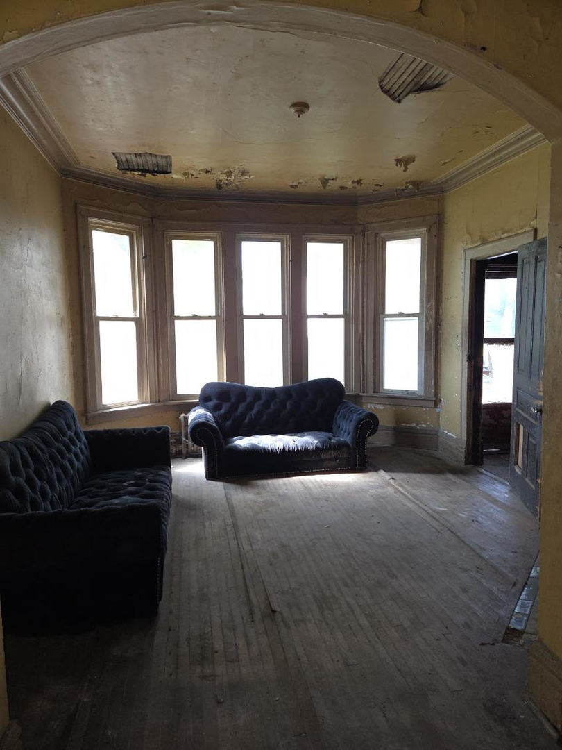 636 West 62nd Street Chicago, IL 60621 - Photo 2 of 16 a living room with furniture and a fireplace