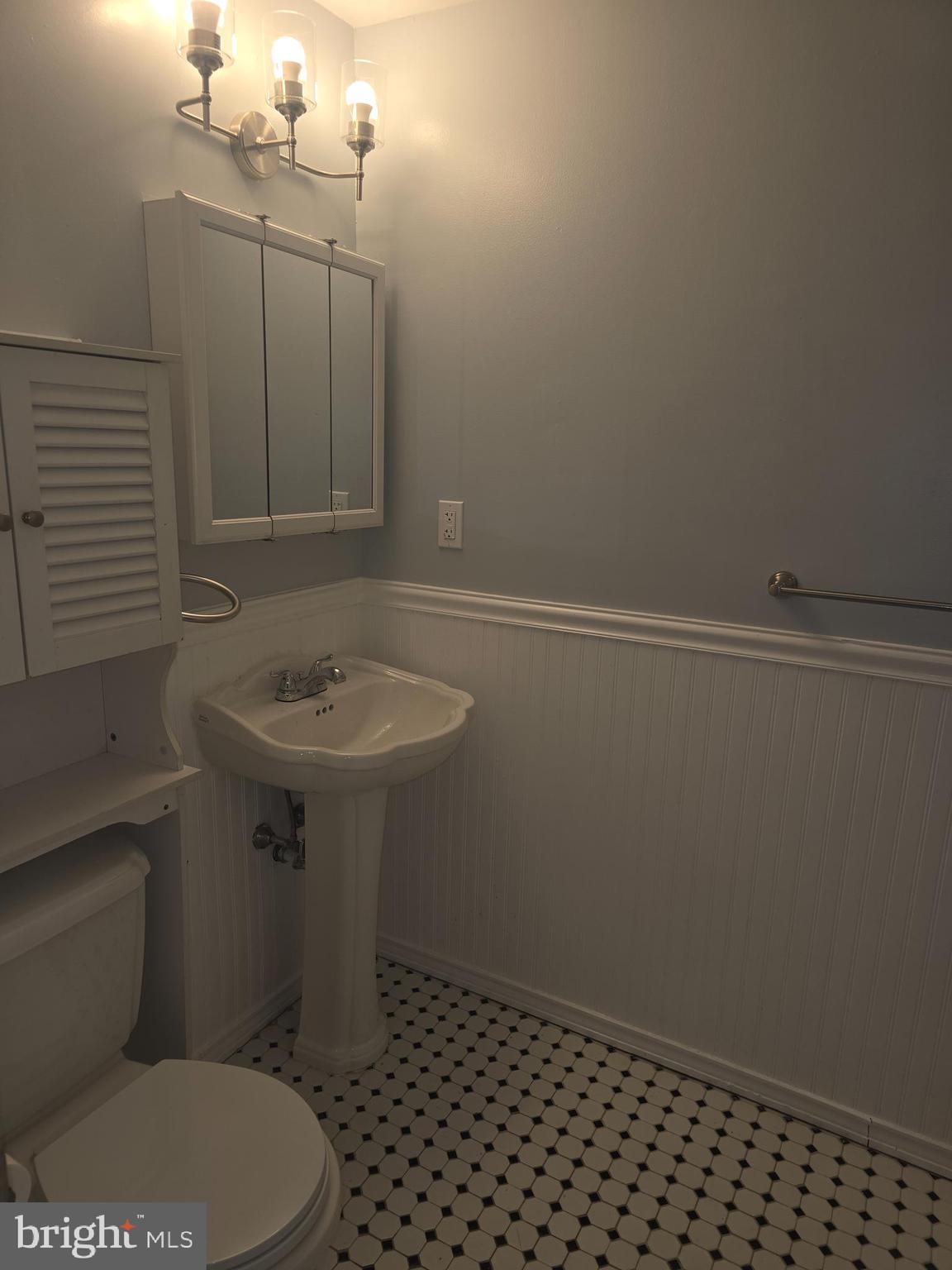 210 Shurs Lane, Unit 4 Philadelphia, PA 19128 - Photo 18 of 24 a bathroom with a sink toilet and vanity