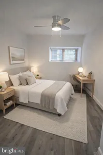 a bedroom with bed and a window