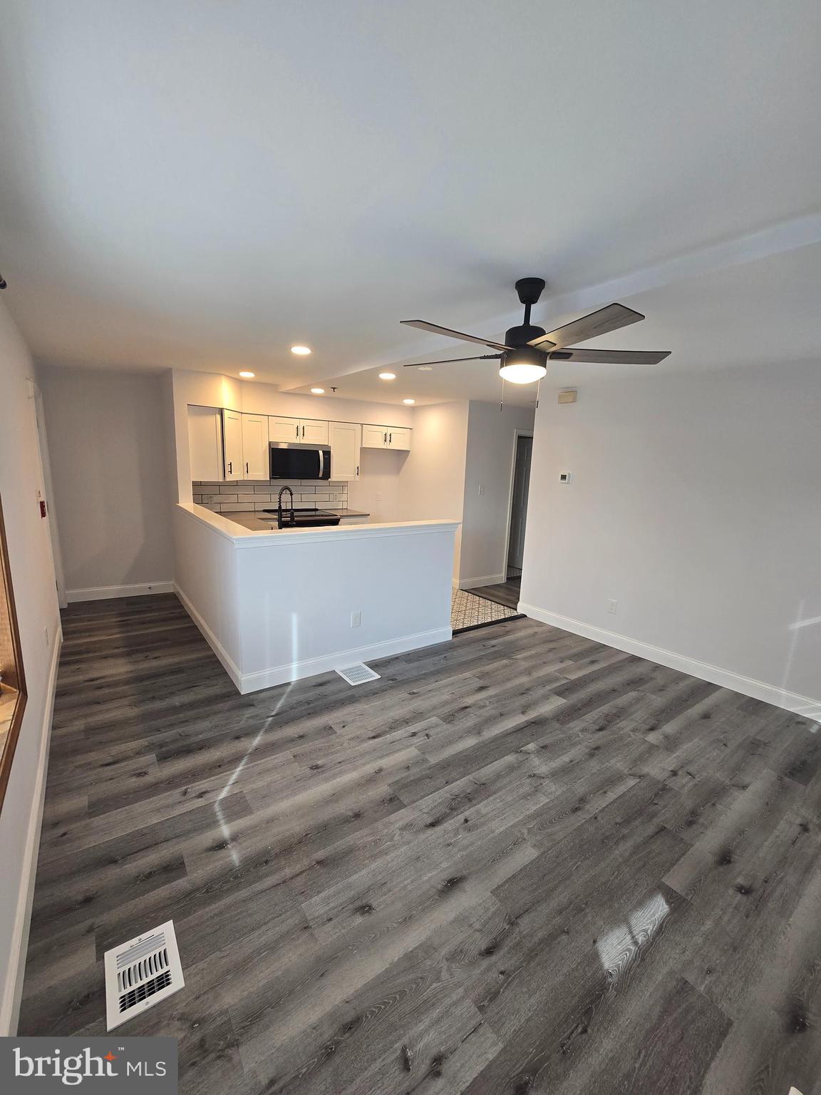 210 Shurs Lane, Unit 4 Philadelphia, PA 19128 - Photo 4 of 24 a view of a room with wooden floor