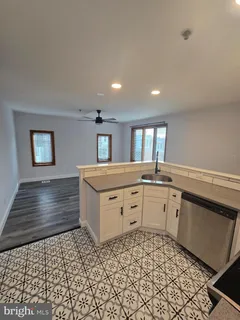 a bathroom with a sink a mirror and a bathtub