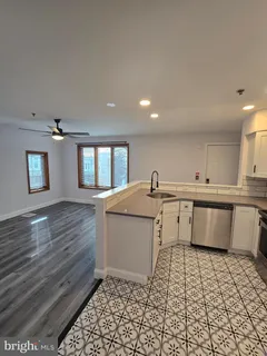 a kitchen with a sink and cabinets