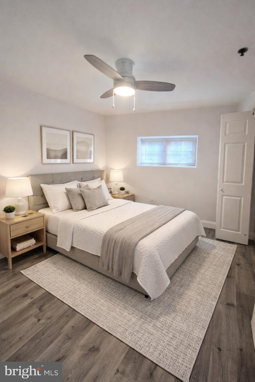 210 Shurs Lane, Unit 4 Philadelphia, PA 19128 - Photo 10 of 24 a bedroom with a bed and a night stand