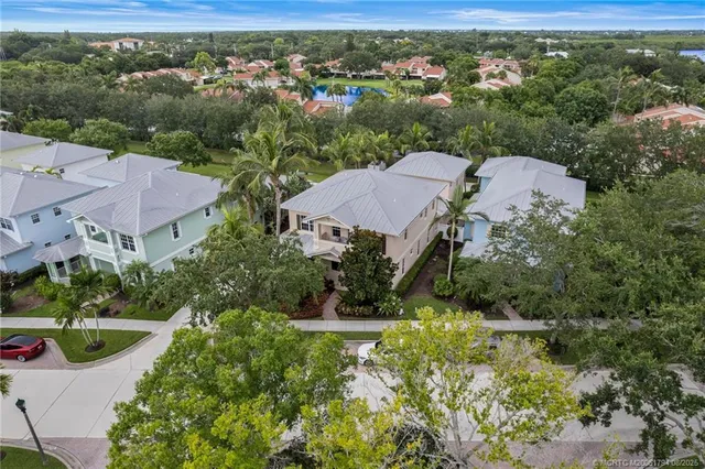 an aerial view of a house with a yard