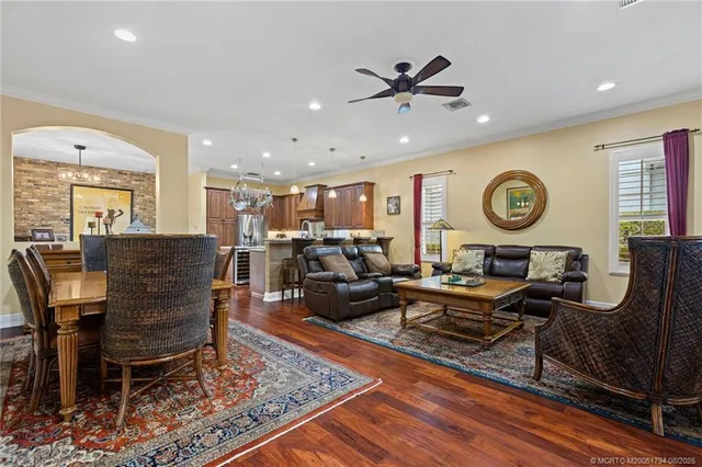 a living room with furniture and a clock