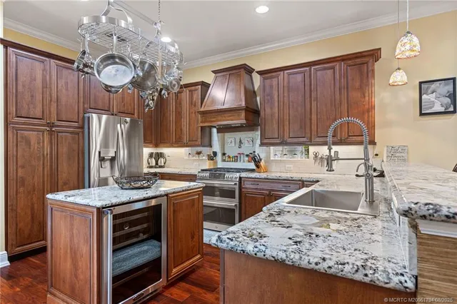 a kitchen with granite countertop cabinets a stove oven and a dining table