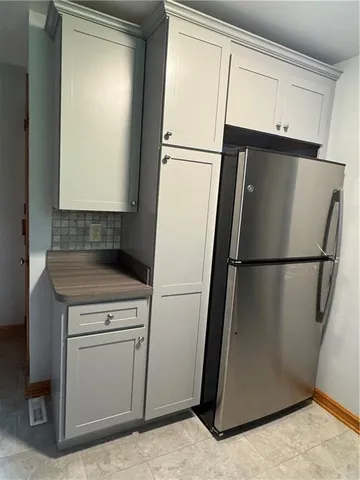 a white refrigerator freezer and a dishwasher in a kitchen