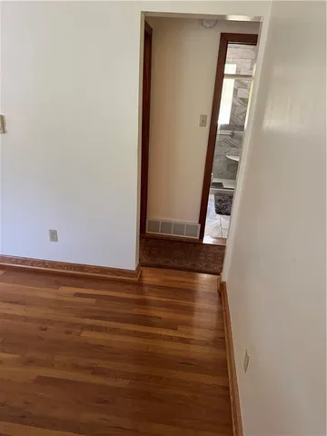 a view of an empty room with stairs