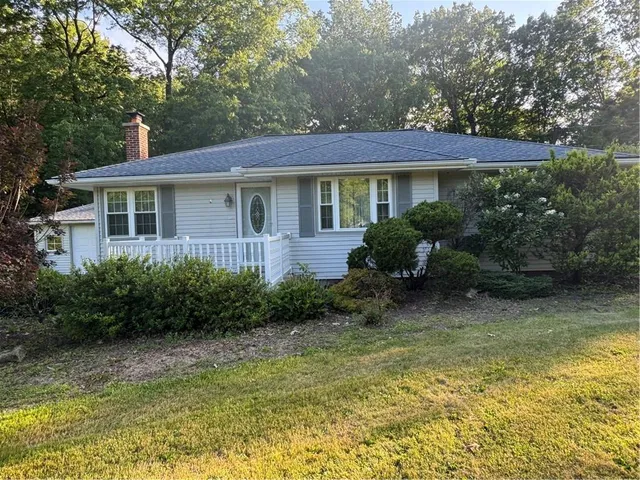 a view of a house with garden and plants