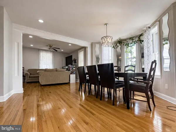 a view of a dining room with furniture and window
