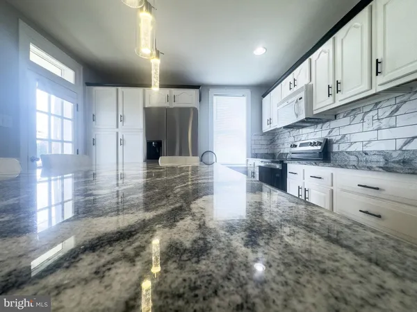 a large kitchen with cabinets