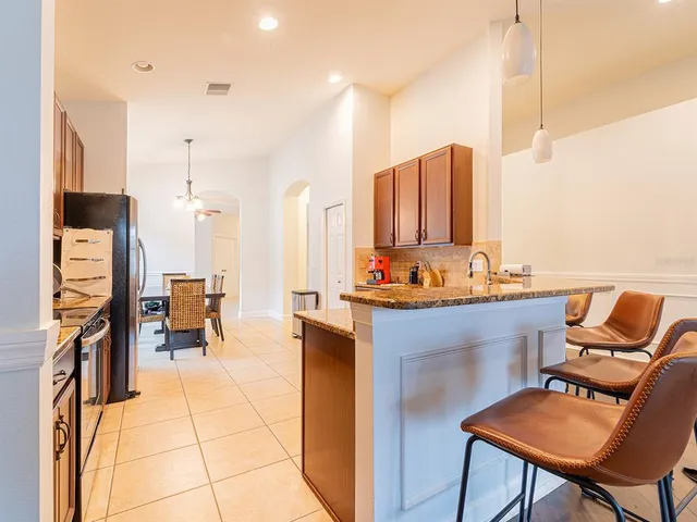 a view of living room with furniture and a rug