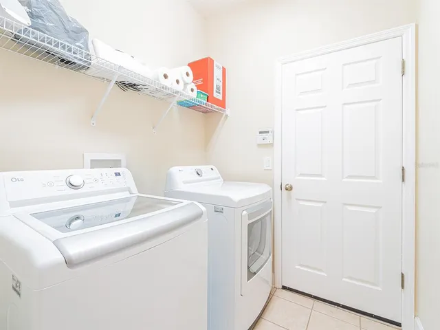 a utility room with dryer and washer